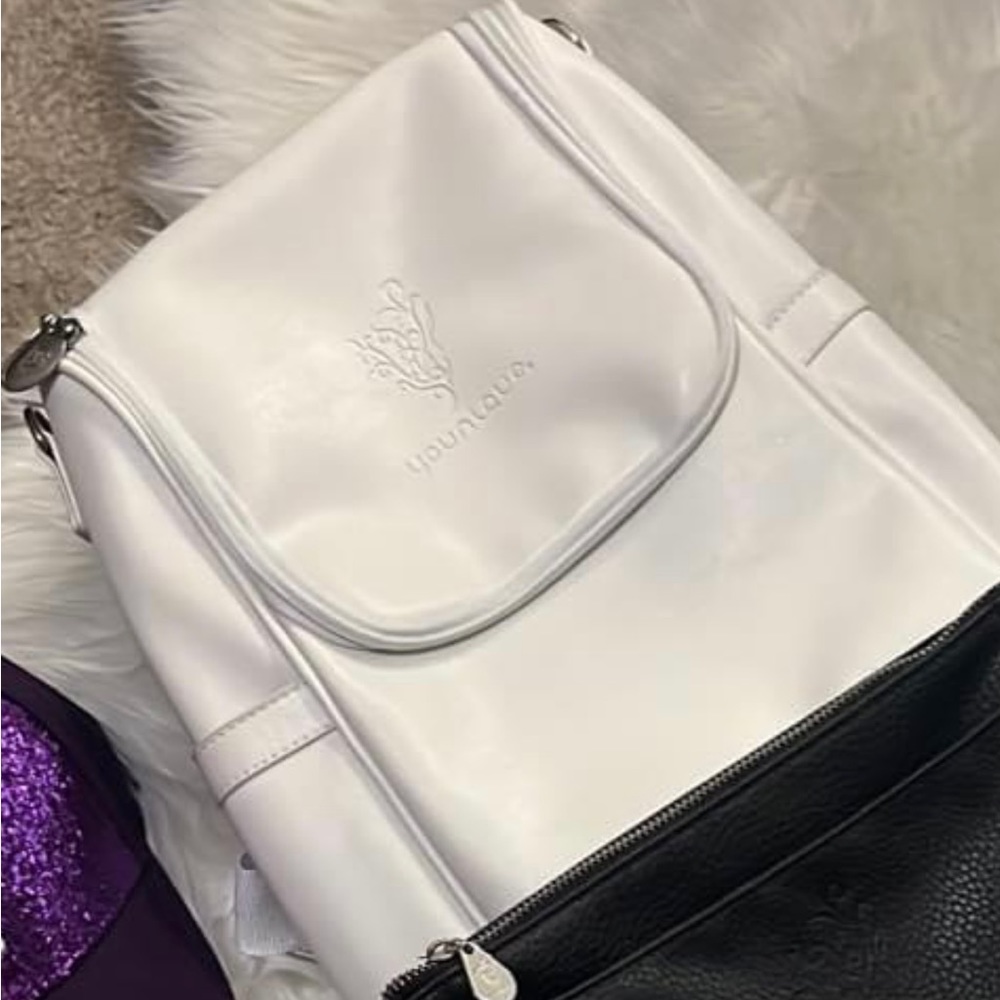 Brand new medium sized backpack! White and zip up and carry over shoulder